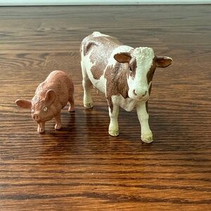 Brown and White Cow and Pig Figurines